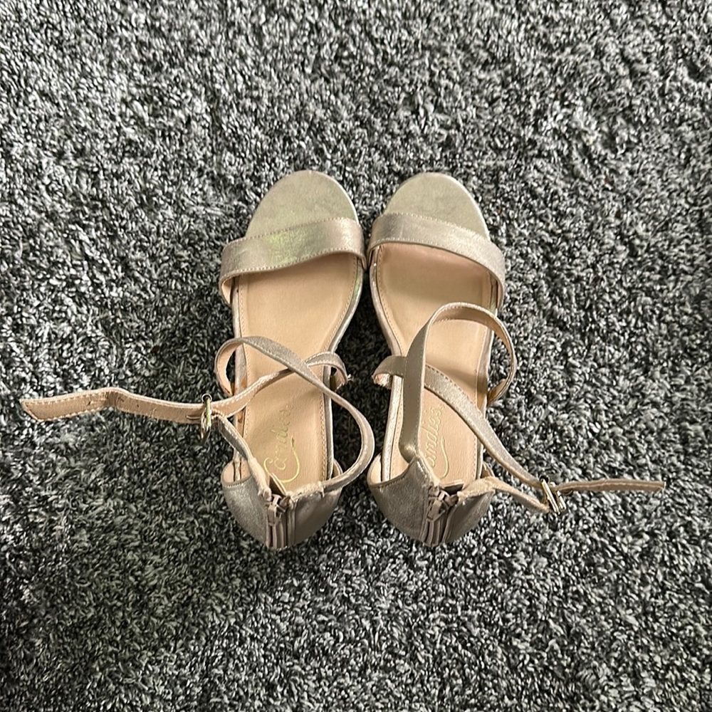 Candie’s gold shimmer wedge sandal.
